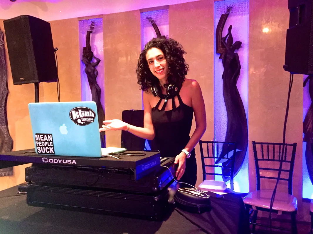 Merav at the decks under purple uplighting