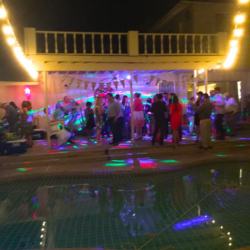 Poolside party lit up at night