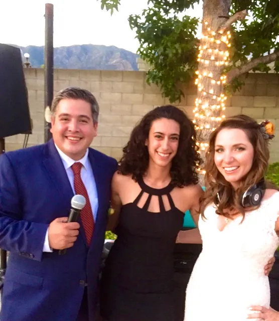 Merav with the couple, groom on the mic
