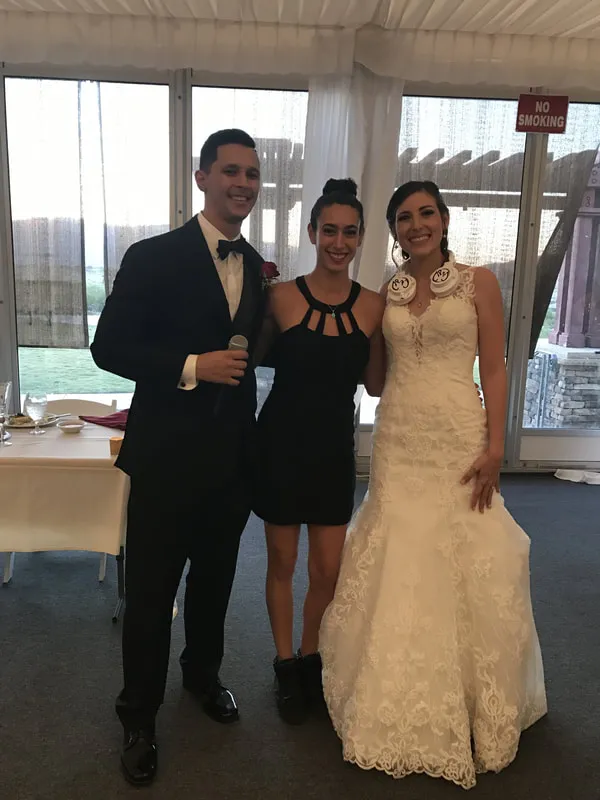 Merav with the couple at the reception