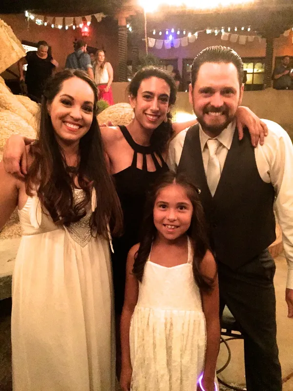 Merav with the couple and their flower girl
